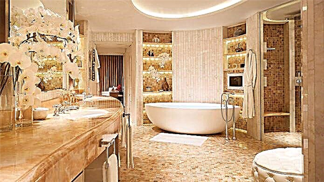 Desain interior kamar mandhi kanthi warna emas 